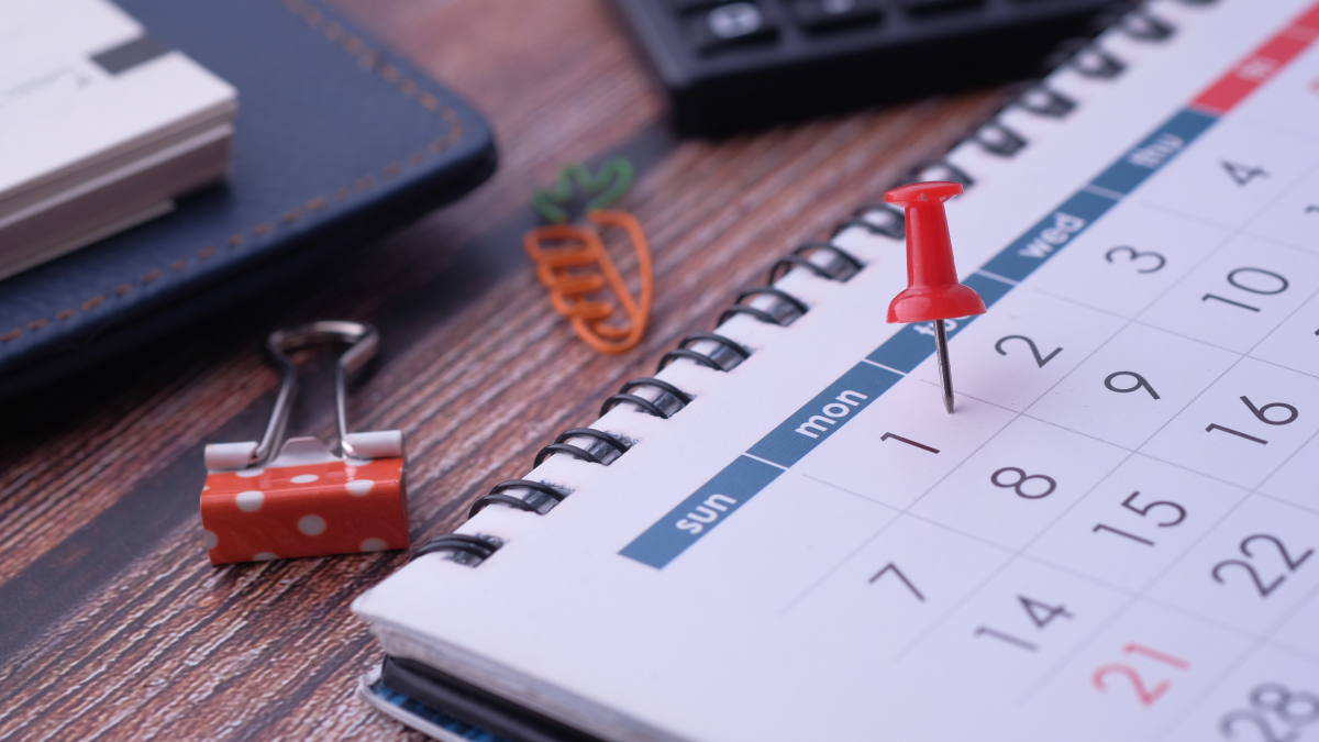 A calendar with a pin marking a date