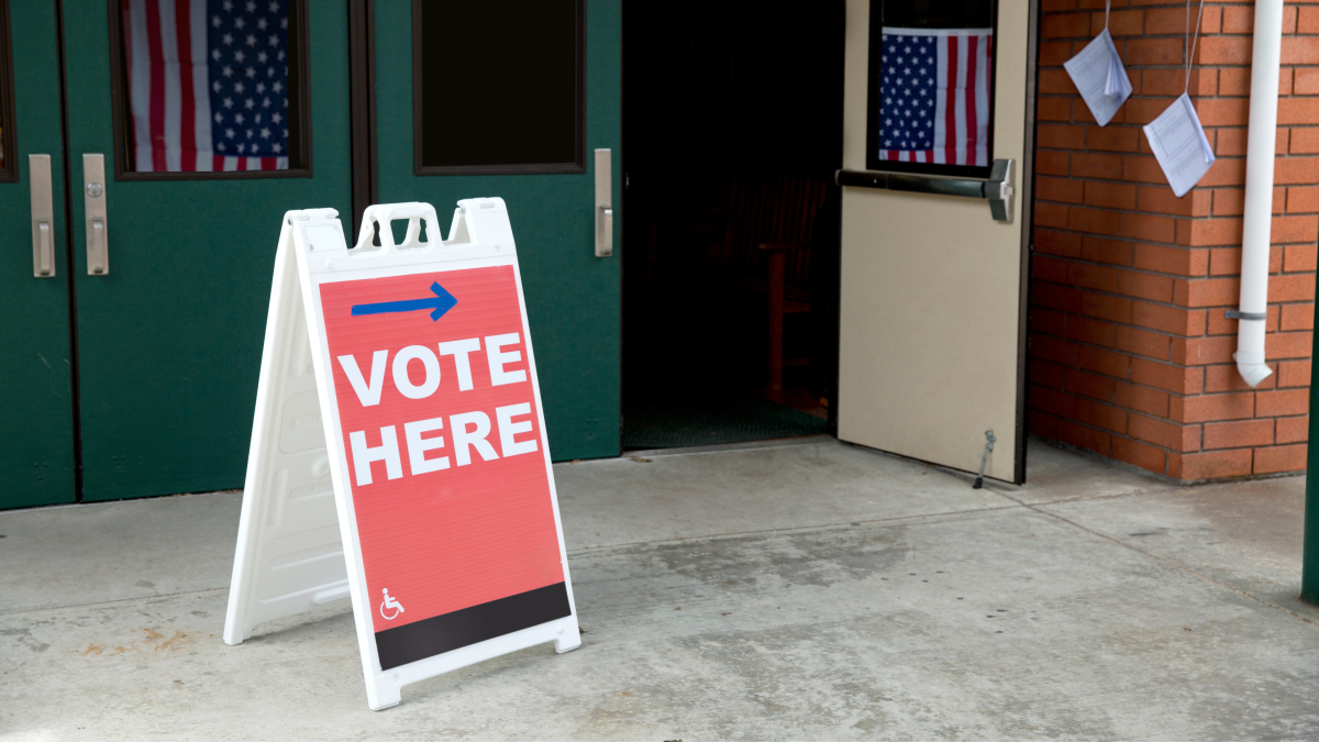 A sign saying Vote Here