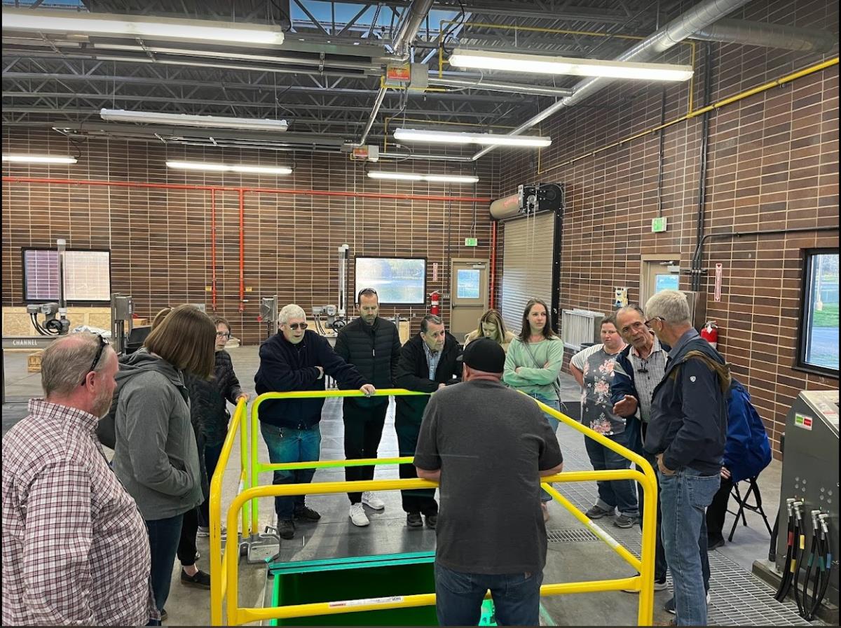 a group of adults at a sewer treatment faculity