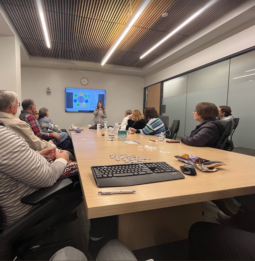 A group of adults in a conference room