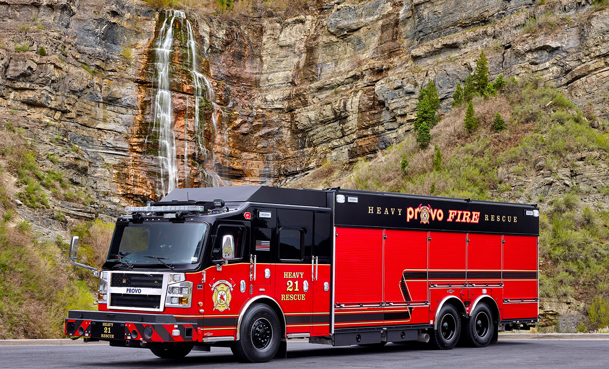 Fire truck in front of a waterfall