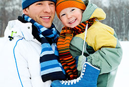 Father and child with skates