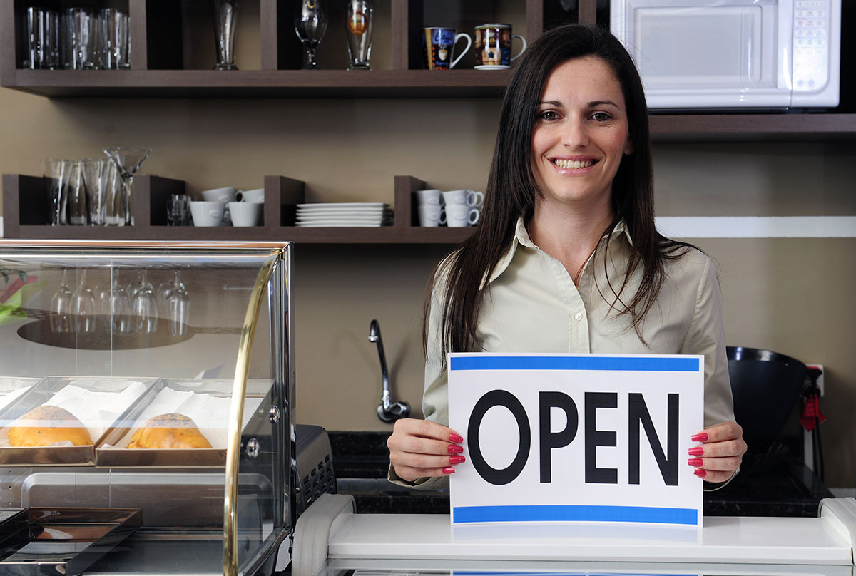 Woman with open sign