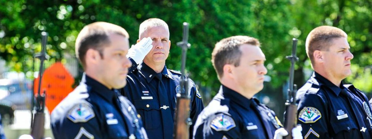 policemen saluting